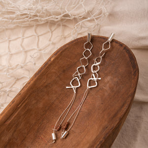 Aretes Peces Plateado - Plomo Hilo Beige